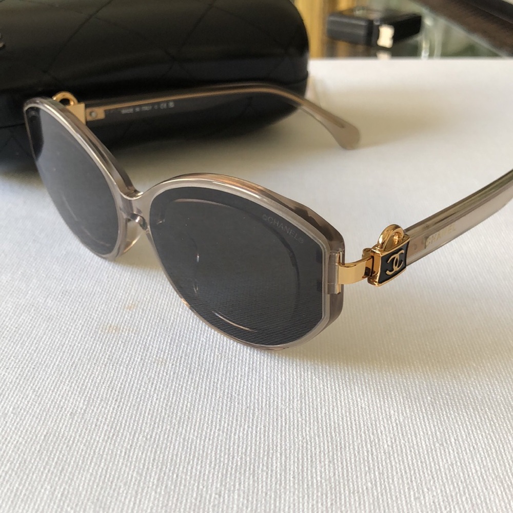 Chanel Gray Oval Sunglasses with CC lock logo on handles